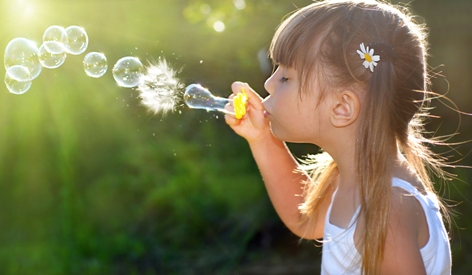 Girl blowing bubbles